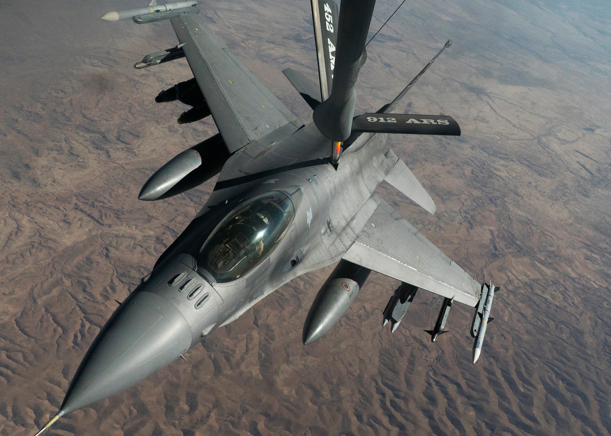 A U.S. Air Force F-16 Fighting Falcon from the 169th Fighter Wing, South Carolina National Guard receives in-flight fuel from a KC-135 Stratotanker assigned to the 28th Expeditionary Air Refueling Squadron during an aerial refueling mission in support of Operation Inherent Resolve over Iraq, Aug. 11, 2018. In conjunction with partner forces, Combined Joint Task Force - Operation Inherent Resolve defeats ISIS in designated areas of Iraq and Syria and sets conditions for follow-on operations to increase regional stability. (U.S. Air Force photo by Master Sgt. Burt Traynor)