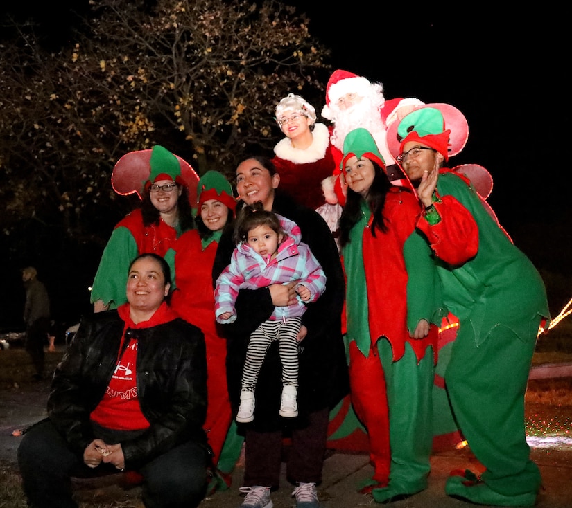 Santa Claus, Mrs. Claus, and several elves’ stop by the annual tree lighting ceremony on Joint Base Anacostia-Bolling, Washington D.C., Dec. 3, 2021. Santa even took the time to take pictures with children and their families. The tree-lighting ceremony marked the beginning of the holiday season at the installation. (U.S. Air Force photo by Brian Nestor)