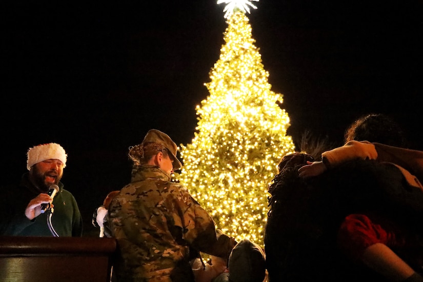 U.S. Air Force Col. Cat Logan, Joint Base Anacostia-Bolling and 11th Wing commander, and students from LEARN D.C. turn on the lights during the annual tree lighting ceremony on Joint Base Anacostia-Bolling, Washington D.C., Dec. 3, 2021. The tree-lighting ceremony marked the beginning of the holiday season at the installation. (U.S. Air Force photo by Brian Nestor)