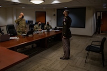 USAREC Command Sgt. Maj. saluting Soldier presenting himself to the board.