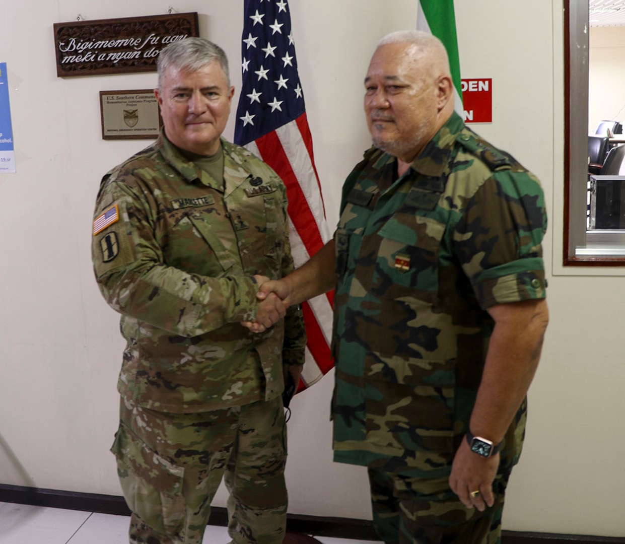 U.S. Army Maj. Gen. Jeffrey Marlette, adjutant general for the South Dakota National Guard, shakes hands with Col. Jerry Slijngard, Suriname’s National Crisis Coordinator, during a distinguished leaders’ visit to Paramaribo, Suriname, Nov. 24, 2021.