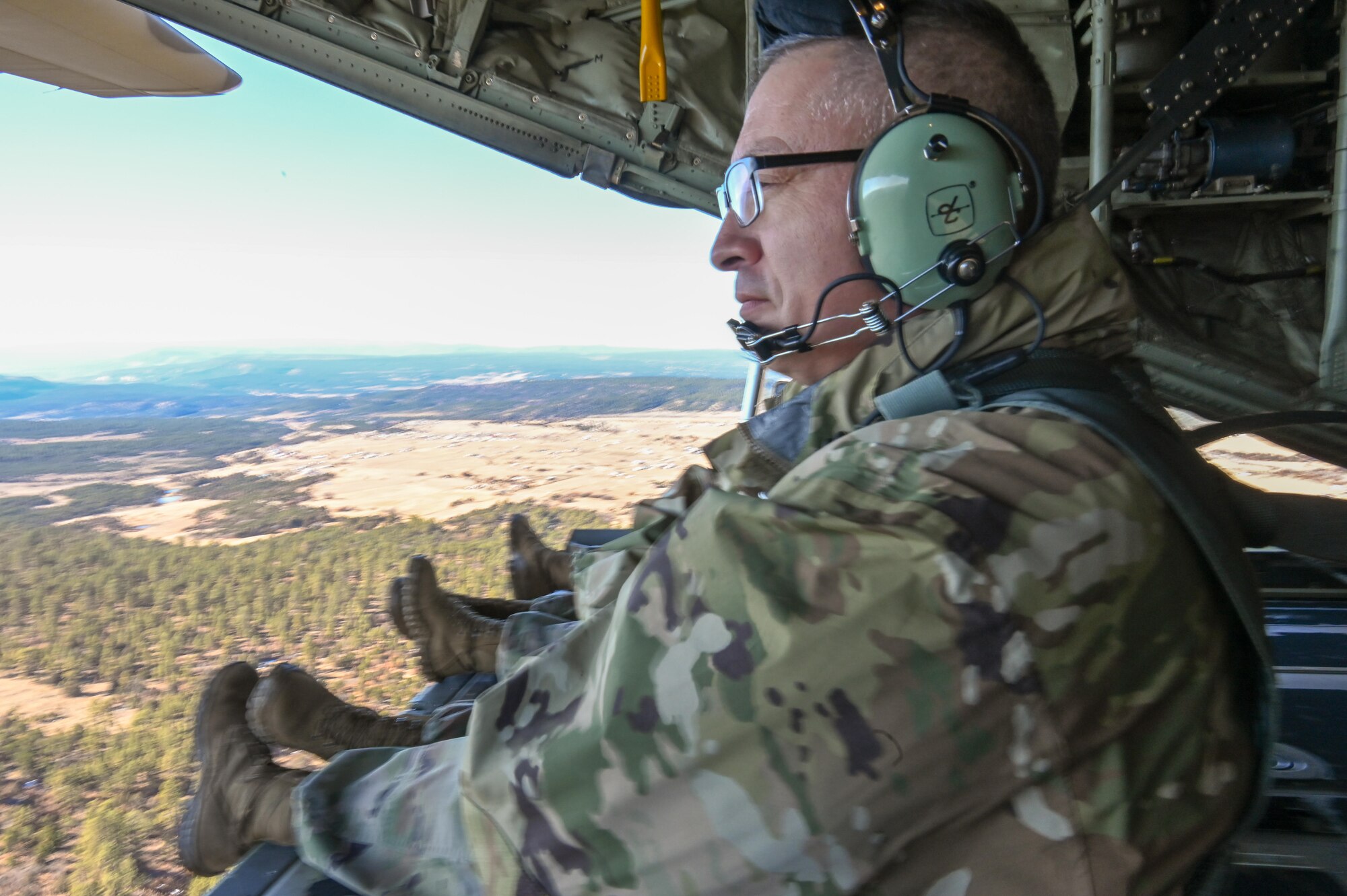 Maj. Gen. Kenneth Nava sits on the back of a C-130 during his final flight.