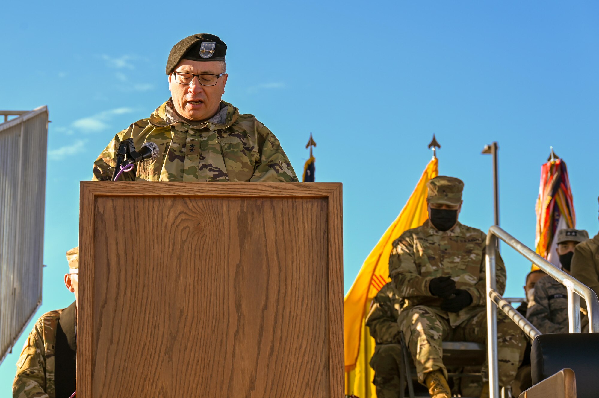 Maj. Gen. Kenneth Nava gives a speech at a podium