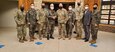 Col. Samuel Hunter, 658th Regional Support Group Commander (right middle) and Col. Sung Gyun Kang, Chief of Mobilization for Mobilization Forces Command, Republic of Korea (ROK) Army (left middle) pose for a photo with members of their staff while doing a tour of Training Support Activity Korea (TSAK) at Camp Humphreys. The TSAK provides training capabilities for forces located on the peninsula. The tour of the facility was conducted to prepare for future joint-training opportunities between the U.S. and its ROK Army allies.