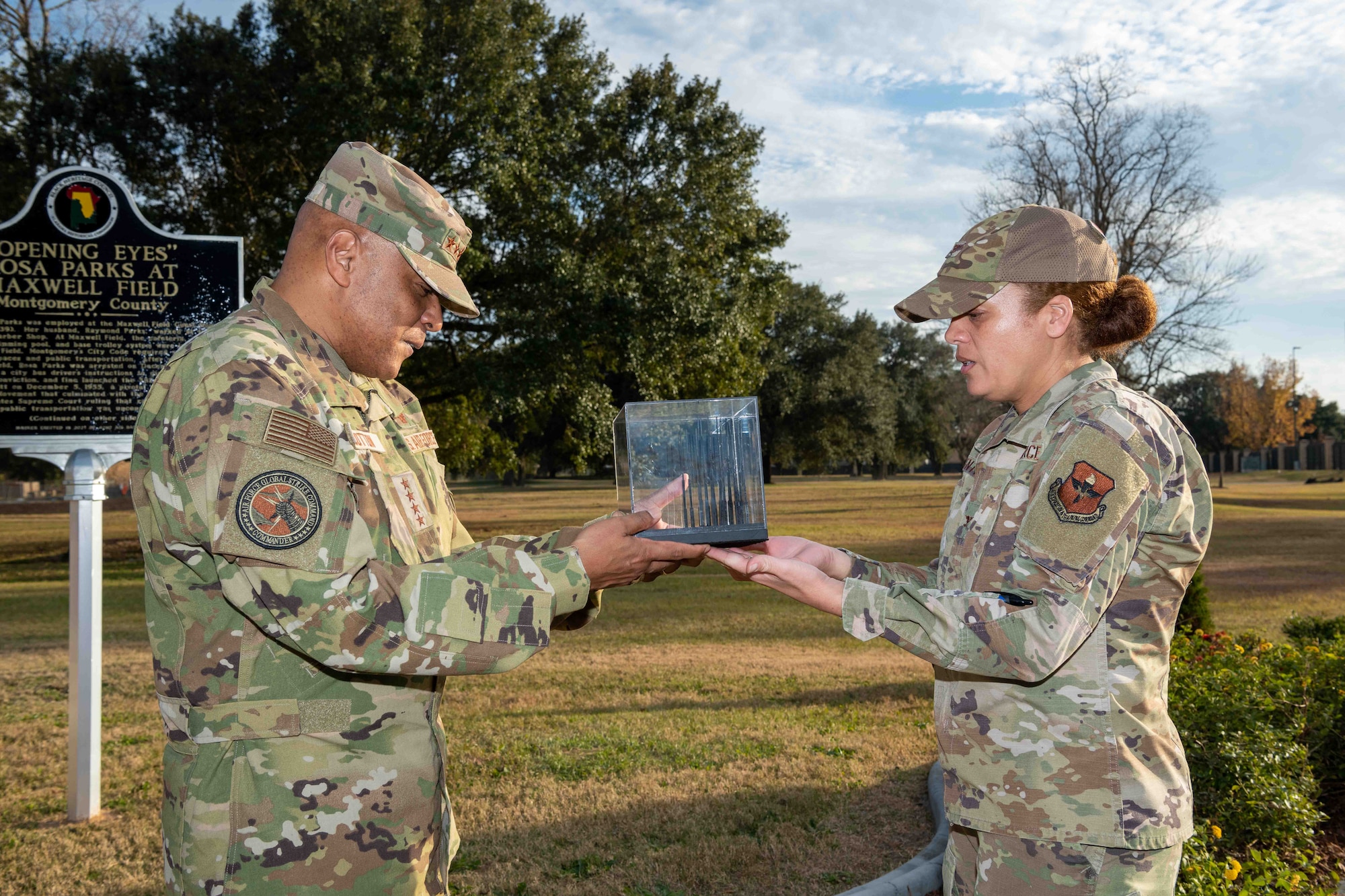 Col. Eries Mentzer, Commander, 42d Air Base Wing, presents a replica of the Rosa Parks memorial sculpture created by Ian Mangum on Maxwell AFB to Gen. Anthony J. Cotton, Commander, Air Force Global Strike Command and Commander, Air Forces Strategic-Air, U.S. Strategic Command, Dec. 3, 2021. (US Air Force photo by Melanie Rodgers Cox)