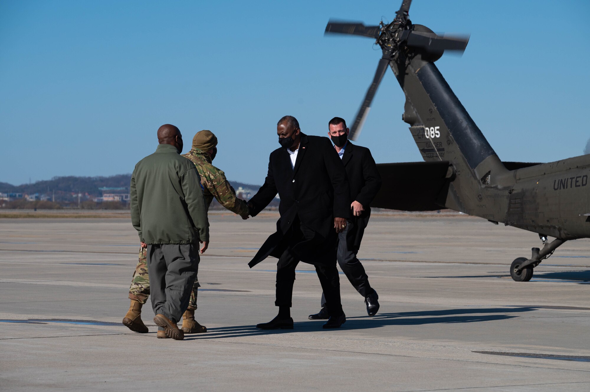 Col Henry Jeffress, 51st Fighter Wing vice commander and Chief Master Sgt. Justin Apticar, 51st Fighter Wing command chief, bids farewell to Lloyd J. Austin III, United States Secretary of Defense, at Osan