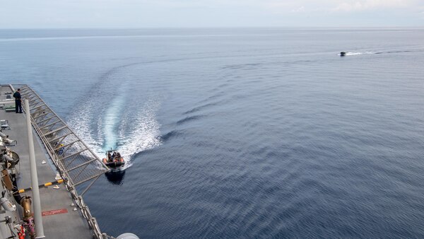 211206-N-PH222-1636 SAVU SEA (Dec. 6, 2021) Two rigid hull inflatable boats of the Timor-Leste Defense Force maneuver alongside Independence-variant littoral combat ship USS Charleston (LCS 18) during during Cooperation Afloat Readiness and Training (CARAT) exercise. In its 27th year, the CARAT series is comprised of multinational exercises, designed to enhance U.S. and partnered navies’ abilities to operate together in response to traditional and non-traditional maritime security challenges in the Indo-Pacific region. Charleston, part of Destroyer Squadron (DESRON) 7, is on a rotational deployment in the U.S. 7th Fleet area of operation to enhance interoperability with partners and serve as a ready-response force in support of a free and open Indo-Pacific region. (U.S. Navy photo by Mass Communication Specialist 2nd Class Ryan M. Breeden)