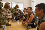An Army officer visits wounded warriors.