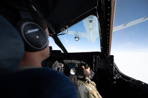 Maj. Christopher Rinaman, 22nd Airlift Squadron C-5M Super Galaxy pilot, maneuvers a C-5M toward a KC-46A Pegasus assigned to McConnell Air Force Base, Kan., for an aerial refueling, Dec. 14. 2020, over Nevada. The KC-46A is the newest refueling aircraft of the U.S. Air Force.