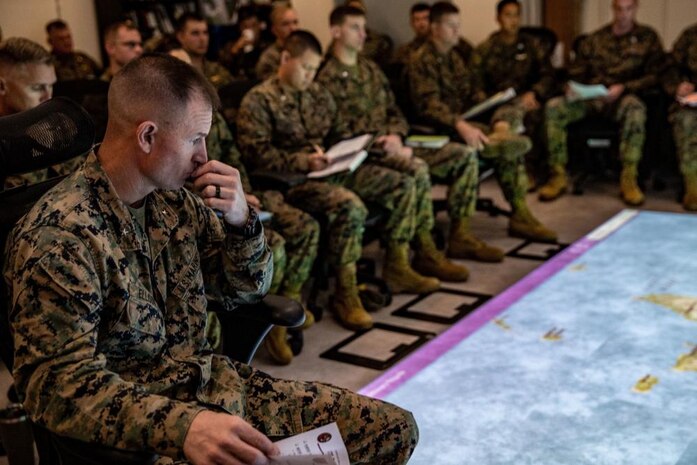 U.S. Marine Corps Brig. Gen. Kyle Ellison, Commanding General, 3d Marine Expeditionary Brigade (MEB), addresses Marines and Sailors at the rehearsal of concept brief for Yama Sakura 81 on Camp Courtney, Okinawa, Japan Dec. 4, 2021. Yama Sakura is the largest joint and bilateral command post exercise conducted by U.S. Army Pacific and the Japanese Ground Self Defense Force designed to increase joint force lethality, enhance design and posture, and strengthen alliances and partnerships (U.S. Marine Corps photo by Staff Sergeant Andrew Ochoa).