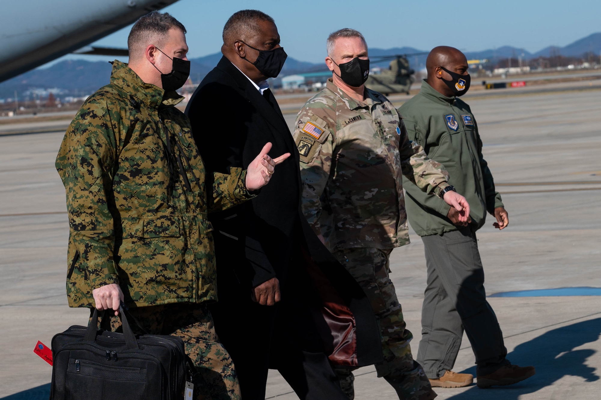 Lloyd J. Austin III, United States Secretary of Defense, heads towards his plane at Osan Air Base