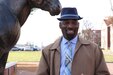 Preston Mingo in front of the Blackjack statue