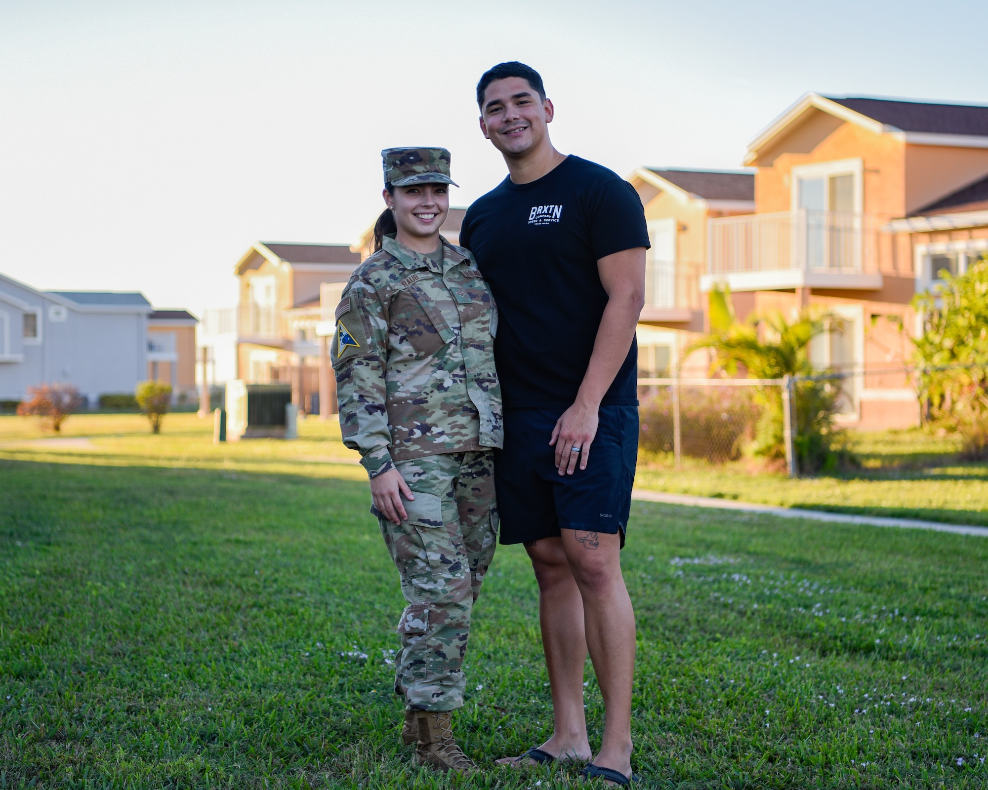 U.S. Air Force Airman 1st Class Dakota Raub and her husband, Gerardo Verdugo, stand outside their home on Patrick Space Force Base, Fla., December 2, 2021. Raub and her husband moved to Patrick SFB in March of 2021 for her first duty assignment. (U.S. Space Force photo by Airman 1st Class Thomas Sjoberg)
