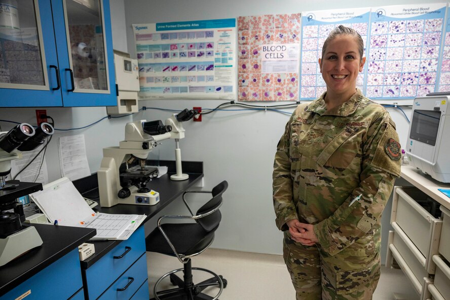 An Airman poses for a photo in the lab.