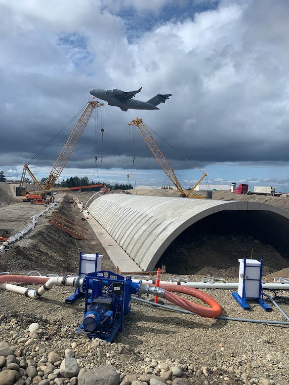 Construction on the single-span concrete arch, that replaced the two steel pipe culverts, at Joint Base Lewis-McChord Airfield, Tacoma, Washington.