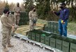 Lawrence Hill, a Joint Munitions Command Logistics Assistance Representative (Quality Assurance Ammunition Surveillance/Ammunition) assigned to the 405th Army Field Support Brigade’s Army Field Support Battalion Germany, in Vilseck, Germany, provides an ammunition storage briefing to Soldiers assigned to 12th Combat Aviation Brigade at an aircraft forward arming and refueling point in the field. (U.S. Army courtesy photo)