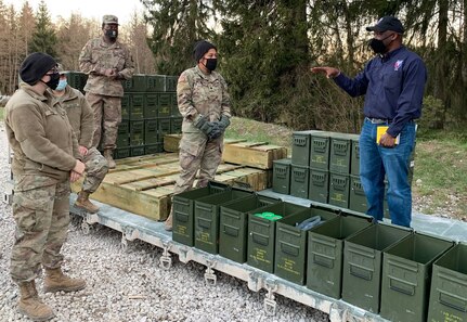 Lawrence Hill, a Joint Munitions Command Logistics Assistance Representative (Quality Assurance Ammunition Surveillance/Ammunition) assigned to the 405th Army Field Support Brigade’s Army Field Support Battalion Germany, in Vilseck, Germany, provides an ammunition storage briefing to Soldiers assigned to 12th Combat Aviation Brigade at an aircraft forward arming and refueling point in the field. (U.S. Army courtesy photo)