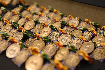 Awards waiting to be handed out to Louisiana National Guard Task Force COVID members during a ceremony at the State Aviation Command in Hammond, Louisiana, Dec. 2, 2021. The ceremony was one of a series across the state to honor more than 850 LANG members who have helped Louisianans during COVID-19 recovery operations.