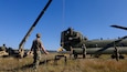 U.S. Army Soldiers with 90th Aviation Support Battalion and Delta Company, 7-158th General Support Aviation Battalion, 11th Expeditionary Combat Aviation Brigade, perform inspections on a CH-47 Chinook at North Fort Hood, TX on November 19, 2021. (U.S. Army photo by Cpl. Nicholas Fuel)