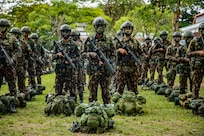 Brazilian army soldiers assigned to 5th Light Infantry Battalion stand in formation during the opening ceremony of Southern Vanguard 22 in Lorena Brazil, Dec. 6 2021. Southern Vanguard 22 was planned as a 10-day air assault operation and was the largest deployment of a U.S. Army unit to train with the Brazilian army forces in Brazil. (U.S Army photo by Pfc. Joshua Taeckens)
