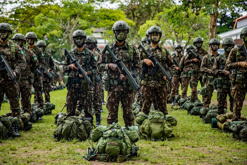 Brazilian army soldiers assigned to 5th Light Infantry Battalion stand in formation during the opening ceremony of Southern Vanguard 22 in Lorena Brazil, Dec. 6 2021. Southern Vanguard 22 was planned as a 10-day air assault operation and was the largest deployment of a U.S. Army unit to train with the Brazilian army forces in Brazil. (U.S Army photo by Pfc. Joshua Taeckens)