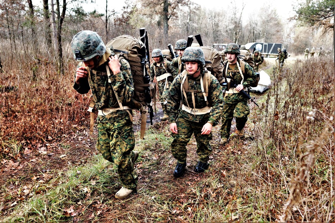 Marines with the 6th Marine Regiment of Camp Lejeune, N.C., participate in training Dec. 1, 2021, in the Cold-Weather Operations Course (CWOC) Class 22-01 at Fort McCoy, Wis. More than 150 Marines participated in the course that was temporarily reworked to support the training needs of the Marines. CWOC staff ran three, three-day field training exercise courses with the Marines from Dec. 1 to 9, 2021. After the first CWOC class completes its training, the CWOC training team of instructors will also conduct five more 14-day training sessions of CWOC into March 2022. (U.S. Army Photo by Scott T. Sturkol, Public Affairs Office, Fort McCoy, Wis.)