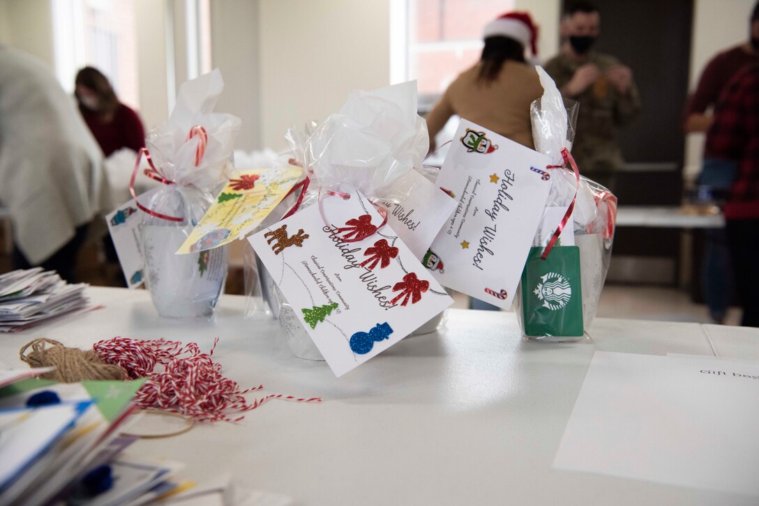 To wish Airmen holiday cheer, mugs are filled with hot cocoa packets, cookies, and other goodies at Chapel 1, Joint Base Andrews, Md., Dec. 6, 2021.