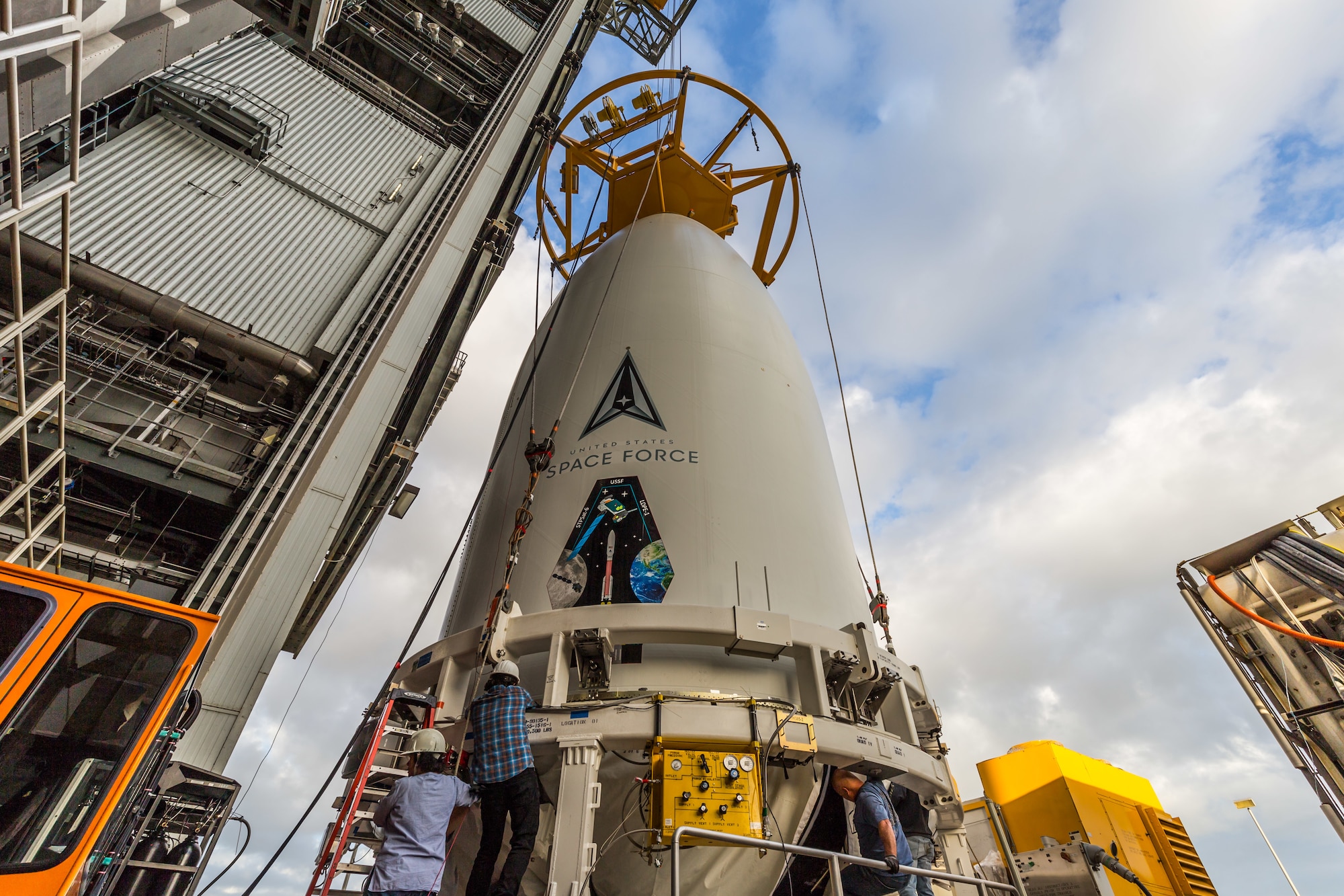 Workers with United Launch Alliance prepare the Space Test Program-3 mission for the U.S. Space Force’s Space Systems Command Nov. 22, 2021, at Cape Canaveral Space Force Station, Fla., for the mounting process with an Atlas V rocket. The mission sent two satellites into space Dec. 7. (Photo by United Launch Alliance)