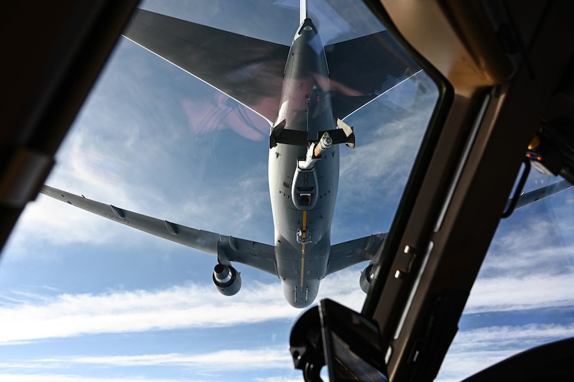 A KC-46 Pegasus prepares to receive fuel from another KC-46, both assigned to Joint Base McGuire-Dix-Lakehurst, New Jersey during their first mission over the North Atlantic Ocean, Dec. 2, 2021. Less than a month after being in the 305th and 514th Air Mobility Wings’ control, the two aircrafts were tasked with their first mission to test the operation and maintenance processes put in place prior to the aircrafts arrival. (U.S. Air Force photo by Senior Airman Ariel Owings)