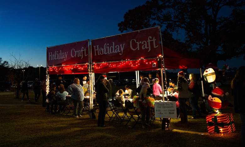 Service members and their families decorate crafts during the annual tree lighting ceremony at Marine Corps Air Station Cherry Point, North Carolina, Dec. 3, 2021.