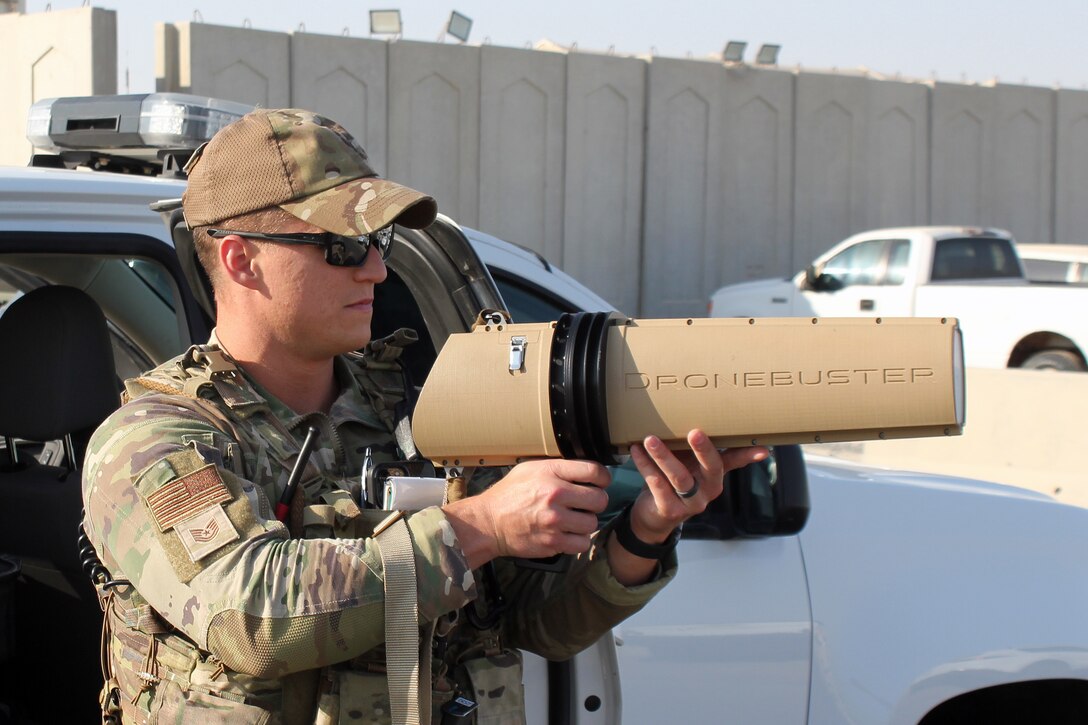 Tech. Sgt. Jacob Wirick operates a dronebuster, used to interrupt the signal to an Unmanned Aerial System, during an exercise at Al Dhafra Air Base, United Arab Emirates, Dec. 3, 2021. The 380th Expeditionary Security Forces Squadron at the base has responsibility for countering potential UAS threats. (U.S. Air Force photo by Master Sgt. Dan Heaton)