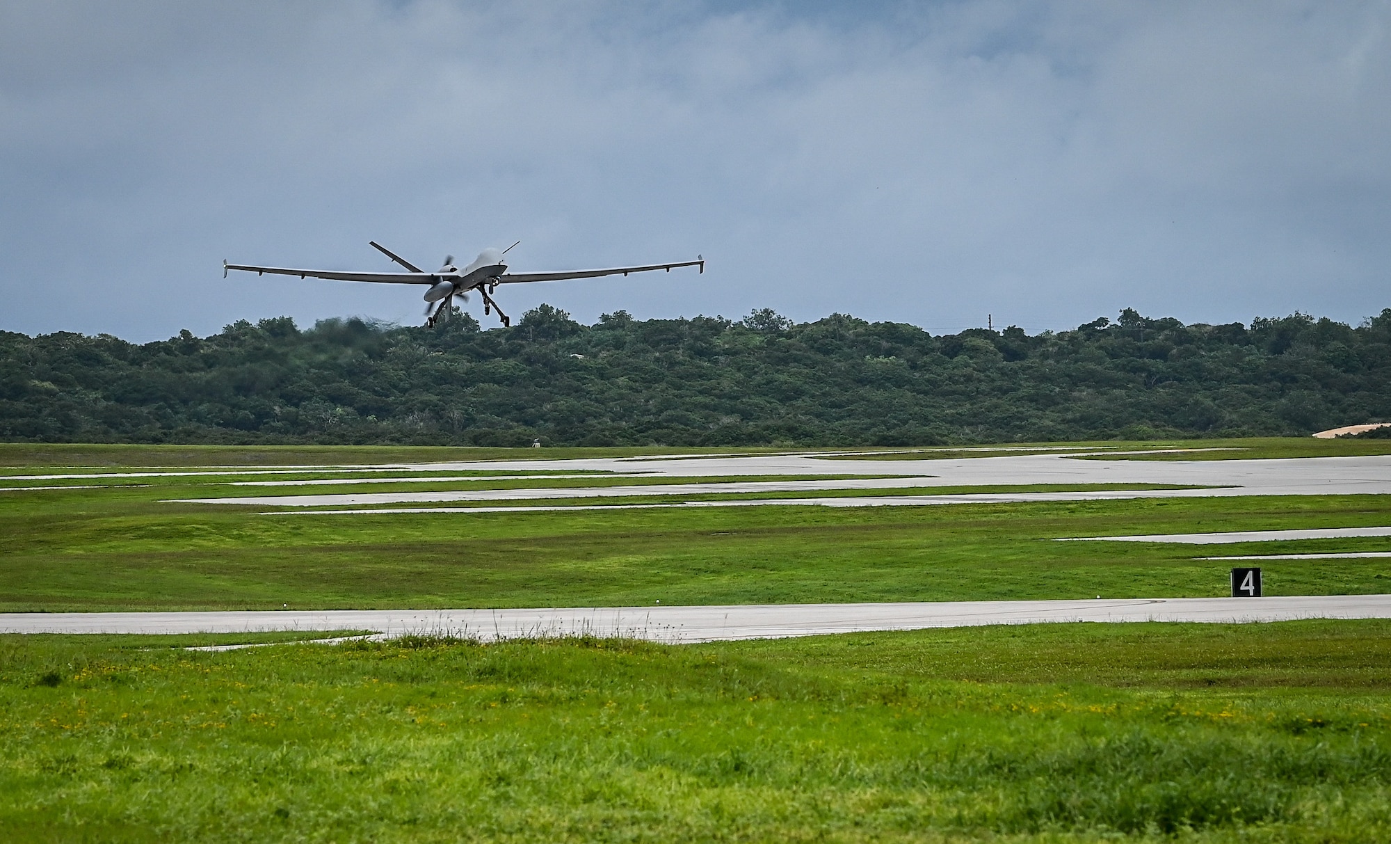 An MQ- Reaper takes off from Andersen Air Force Base, Guam, Oct. 5, 2021. MQ-9 training primarily occurs over land but ACE Reaper is testing the capabilities of using MQ-9s over water to demonstrate our readiness in any environment. The purpose of ACE Reaper is to demonstrate the MQ-9’s capabilities and service members’ abilities to rapidly mobilize and integrate across multiple domains. The exercise also serves as an opportunity to train in a maritime environment and in a different airspace. (U.S. Air Force photo by Staff Sgt. Divine Cox)