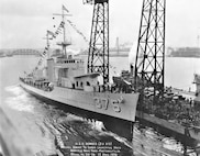 The Mahan-class destroyer USS Downes (DD-375), built by NNSY and shown here during its April 1936 launching, was destroyed at Pearl Harbor.  Machinery and equipment were salvaged to form the basis of the new Downes built at Mare Island Naval Shipyard, which retained both the name and hull number.   The recommissioned ship’s first mission was escorting convoys to Pearl Harbor in March 1944.