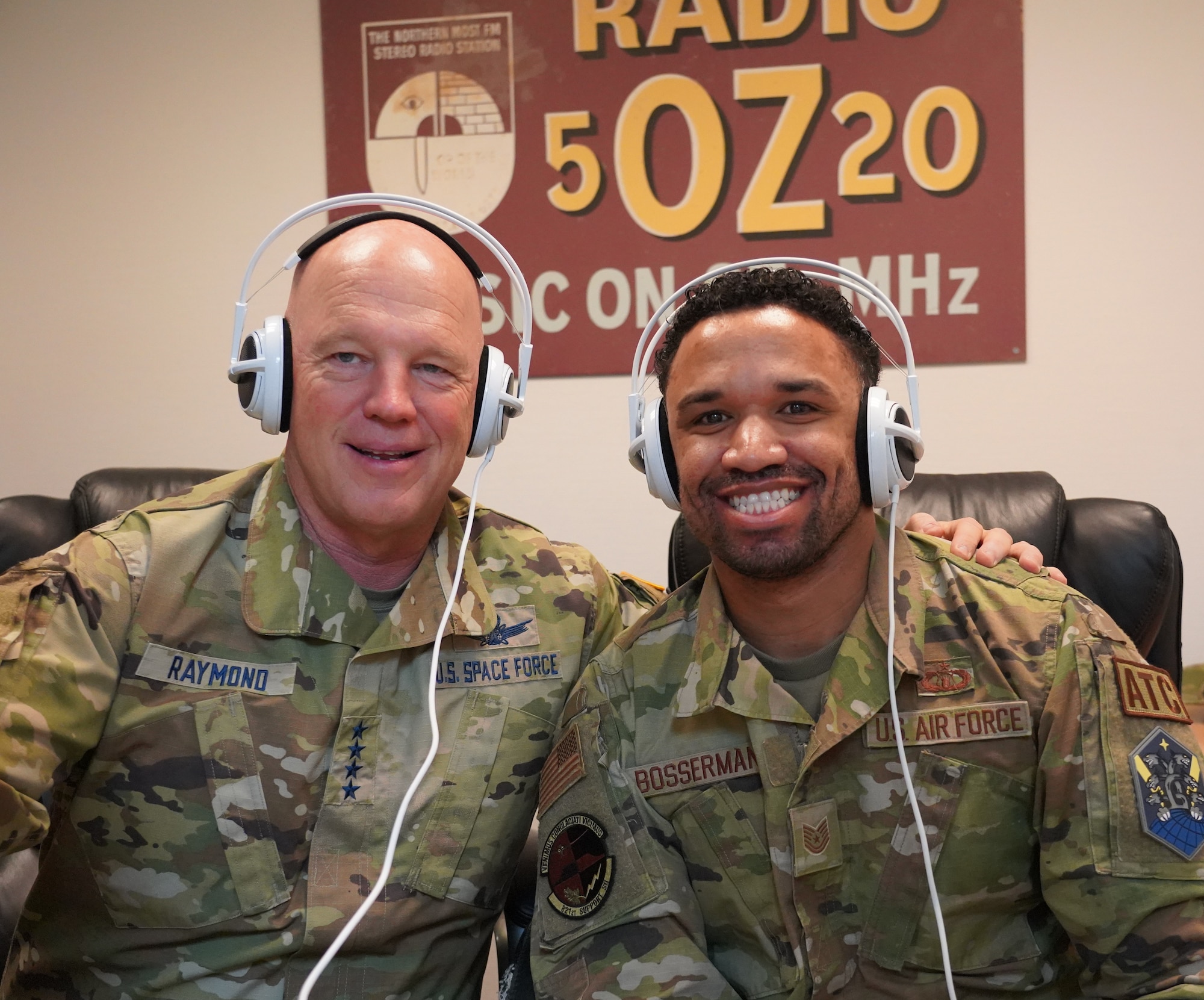 Two men wearing headphones