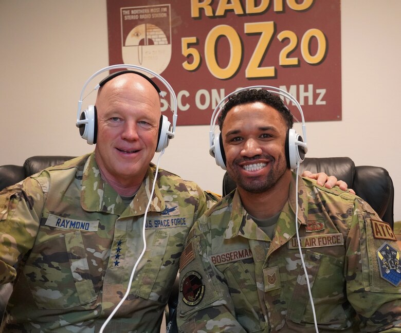 Two men wearing headphones