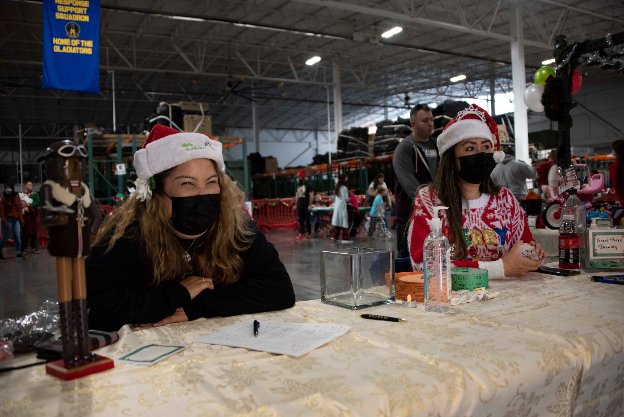 Photos of an event where families got to meet, take a photo with, and receive gifts from Santa Claus.