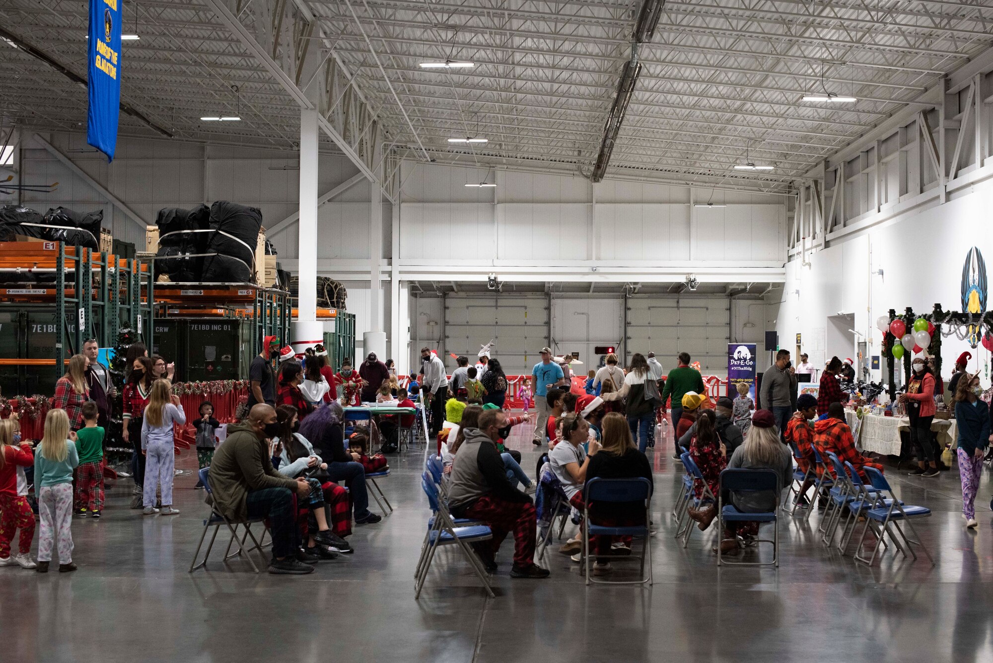 Photos of an event where families got to meet, take a photo with, and receive gifts from Santa Claus.