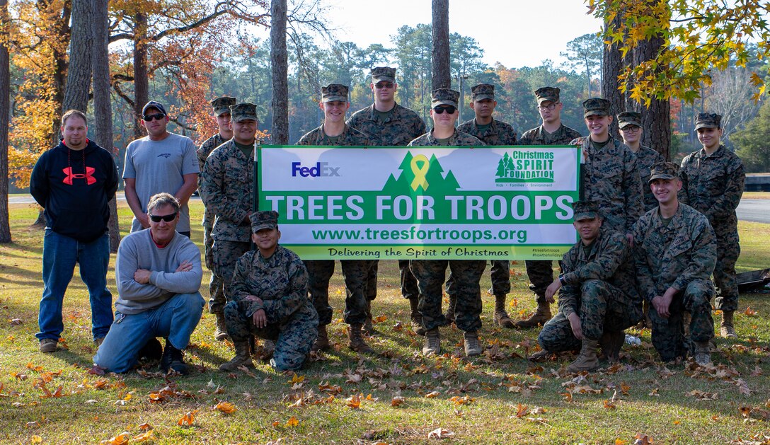 U.S. Marines and volunteers gathered together to help hand out 350 real Christmas trees to service members and their families, at Marine Corps Air Station Cherry Point, Dec. 3, 2021. This annual event hosted by Marine Corps Community Services, is a way to help spread the holiday joy while giving back to the military community.