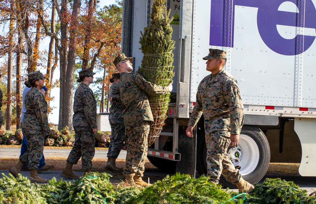 U.S. Marines and volunteers gathered together to help hand out 350 real Christmas trees as part of an annual event hosted by Marine Corps Community Services to help spread the holiday joy while giving back to the military community.
