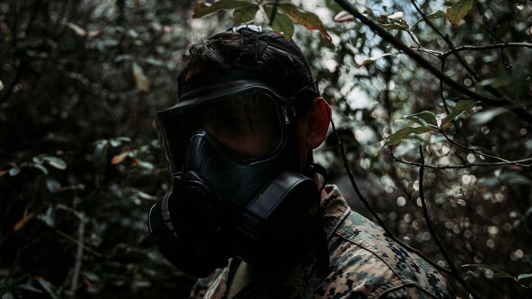 U.S. Marine Corps Cpl. Irving Millan Estrada, a native of Chino Valley, Ariz., and a chemical, biological, radiological, and nuclear (CBRN) operations specialist with Headquarters Battalion, 2d Marine Division (MARDIV), participates in 2-chlorobenzylidene malononitrile (CS gas) training on Camp Lejeune, N.C., Dec. 1, 2021. This training was apart of a Marine Corps Combat Readiness Evaluation for 3rd Battalion, 2d Marine Regiment, 2d MARDIV, to formally evaluate the unit’s combat readiness. (U.S. Marine Corps photo by Lance Cpl. Jacqueline C. Arre)