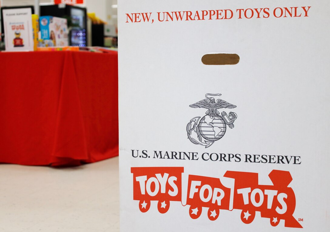 Several Toys for Tots donation boxes are located in the check-out area in the Marine Corps Exchange at Marine Corps Air Station Cherry Point, North Carolina, Nov. 23, 2021.
