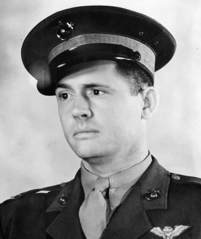 A serious-looking man in uniform poses for a photo.