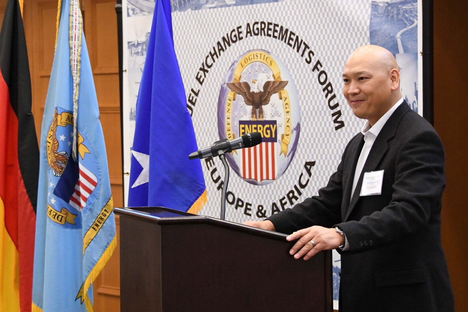 a man stands at a podium