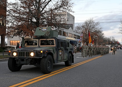 Guardsmen of the197th Field Artillery Brigade, New Hampshire Army National Guard, march down Elm St. in the Manchester Holiday Parade on Dec. 4, 2021.