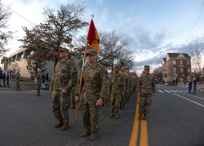 About 100 New Hampshire Guardsmen of the 197th Field Artillery Brigade march in the Manchester Holiday Parade on Elm. St. in Manchester, New Hampshire, Dec. 4, 2021. Photo by Tech. Sgt. Charles Johnston, NHNG Deputy State PAO.