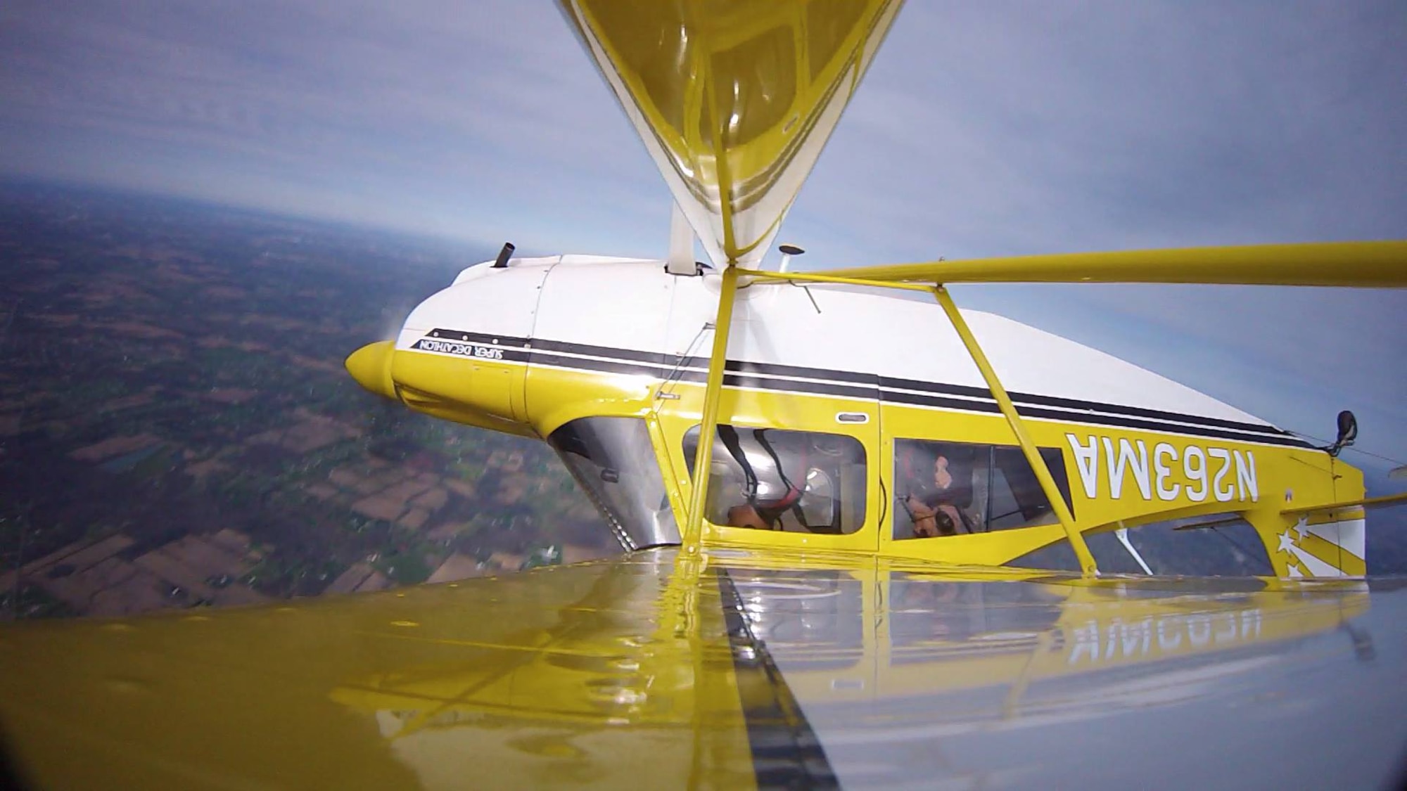 Maj. Ali Hamidani flies inverted in a small aircraft