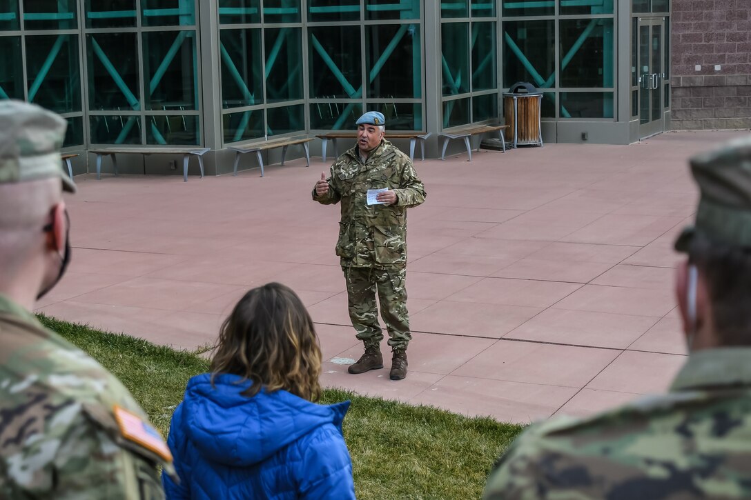 British Army general talks to crowd.