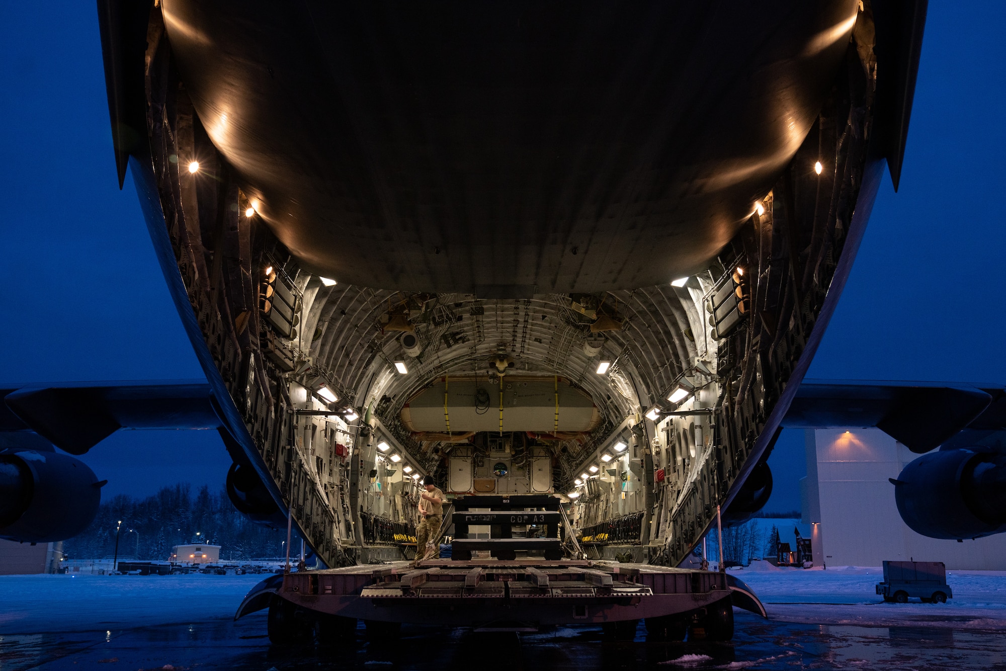 U.S. Air Force Staff Sgt. Anthony Powers, a 3rd Operations Support Squadron loadmaster, prepares a C-17 Globemaster III for a training sortie.