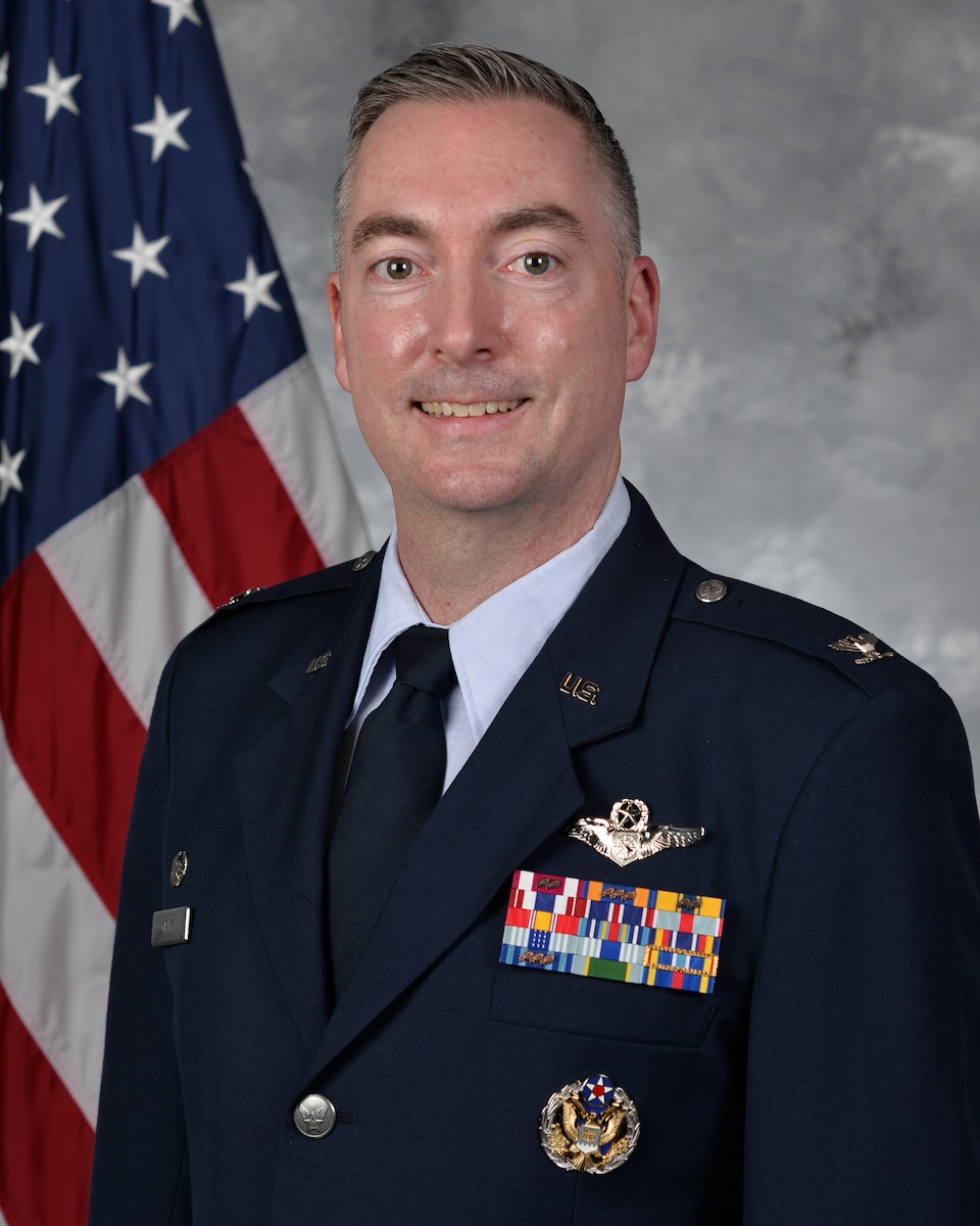 photo of U.S. Air Force Officer in front of U.S. Flag