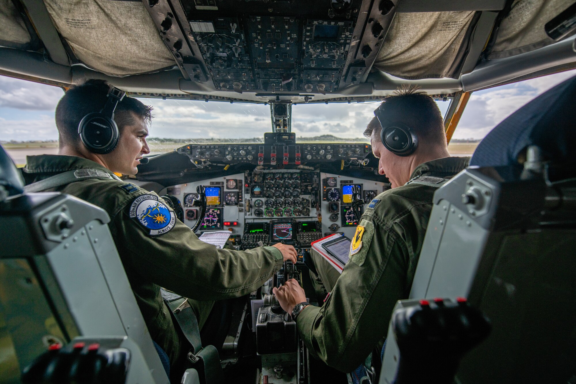 Two pilots discuss the flight plan as they taxi out to the runway